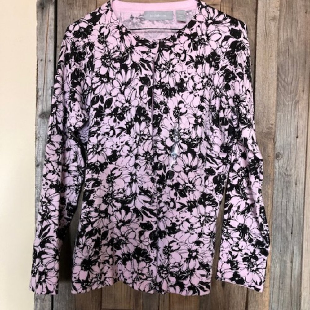 Update: Sold Liz Claiborne button up sweater made of 76% cotton, 24% nylon.